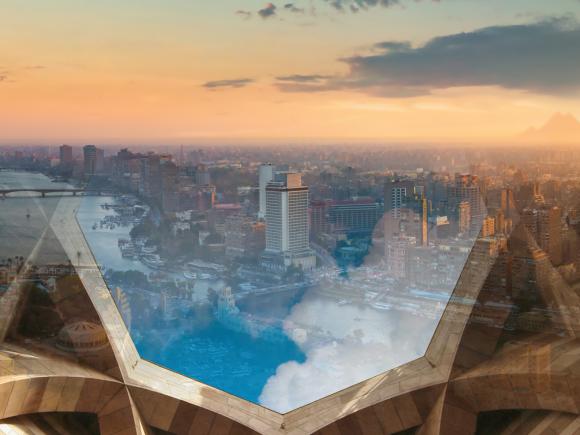 aerial view for Cairo with clouds and AUC architecture in the background, to represent climate change initiative